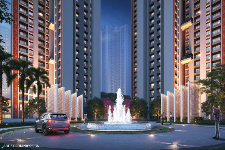 DTC Downtown Rajarhat grand entrance with fountain, high-rise towers and landscaped driveway evening view