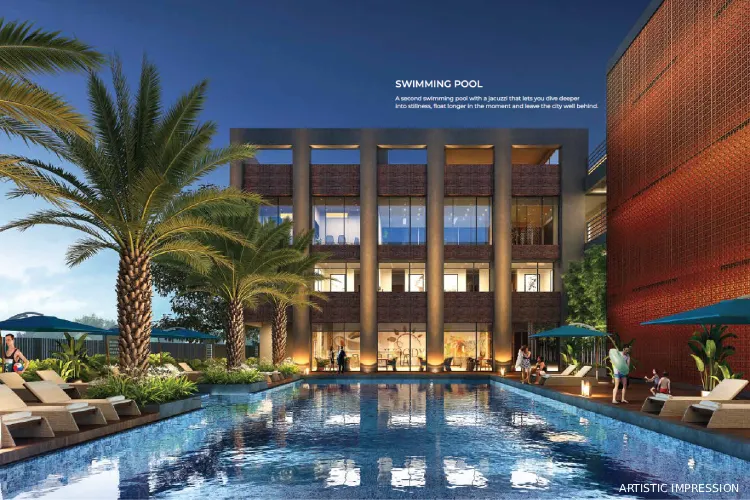 DTC Downtown Rajarhat swimming pool with deck area, palm trees and luxury clubhouse ambiance